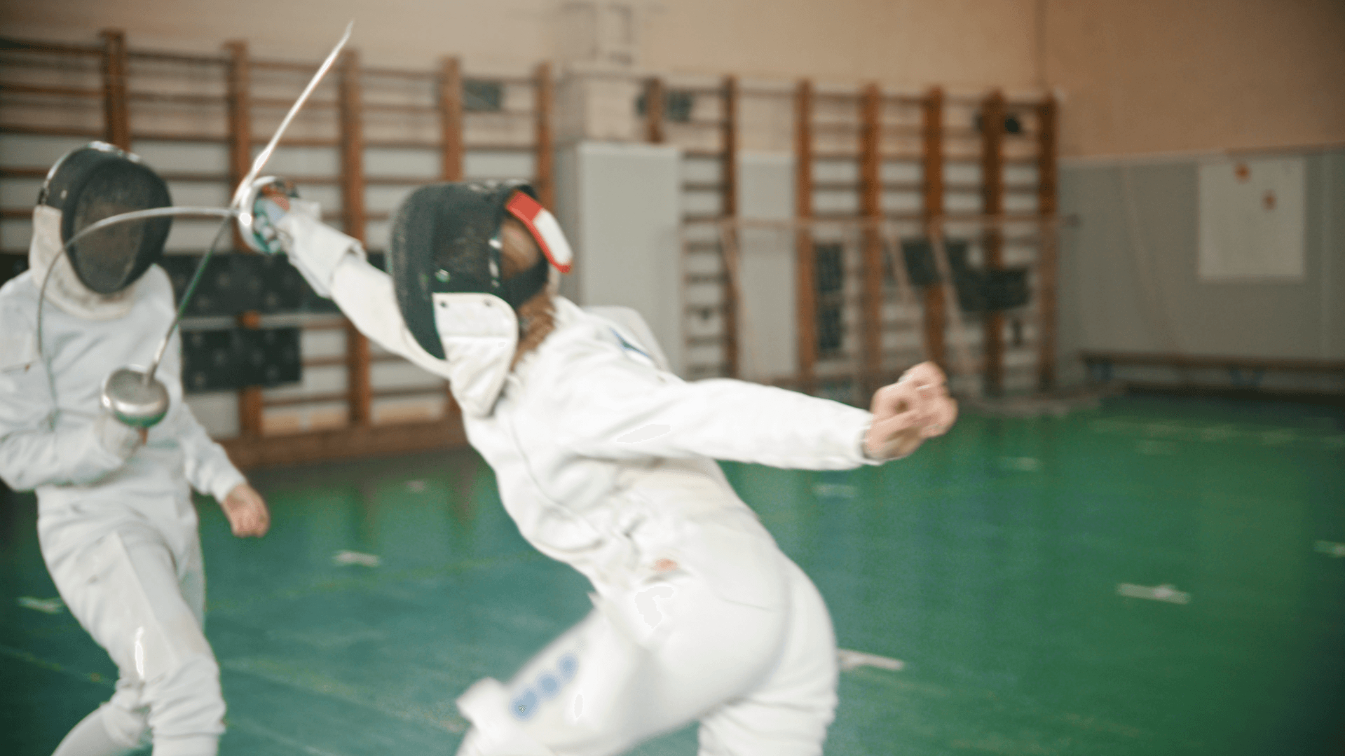 Fencing attack hitting opponent
