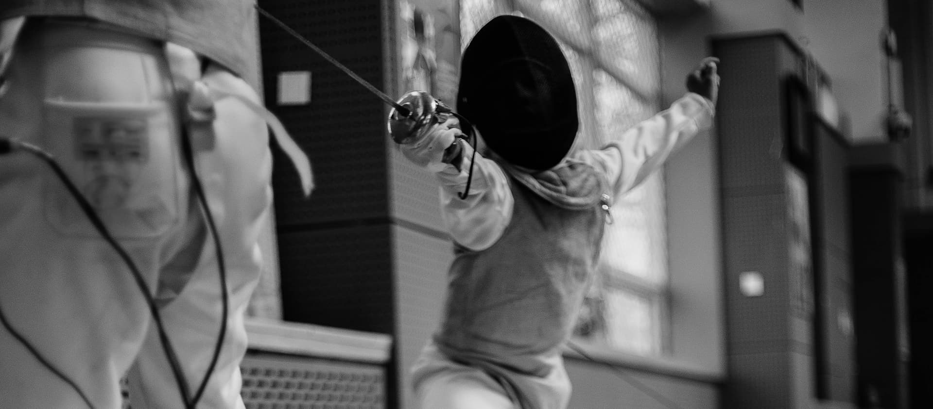 Fencers sparring during a club session